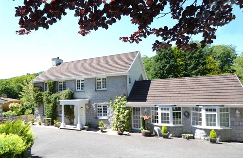 Mount Cottage | Millpool Lodge peaceful haven with 3 acre stunning gardens waterfalls and hottub