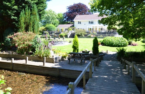 Mount Cottage | Millpool Lodge peaceful haven with 3 acre stunning gardens waterfalls and hottub