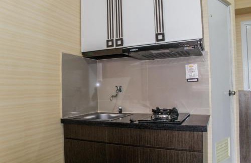 Rawasari Apartment | Minimalist 2BR Green Pramuka City Apartment near Shopping Mall By Travelio