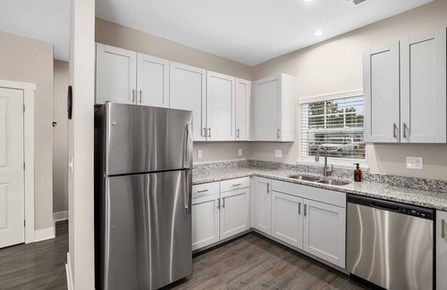 Grandville Condo | Modern 2BR + 2BA Condo with Garage & Patio