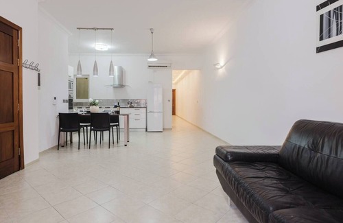 Bugibba Apartment | Modern 3-bedroom, 2-bathroom apartment in the heart of Bugibba, just 1 minute from the beach. Features a fully equipped kitchen, fast Wi-Fi, A/C in all rooms, Smart TV, and all essentials including towels, linen, washer, dryer, and coffee machine !