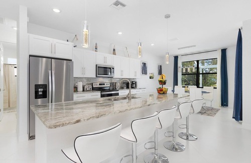 Trafalgar House | Modern 4BD/3BH Waterfront Home with Heated Pool and Golf Access and EV Charger