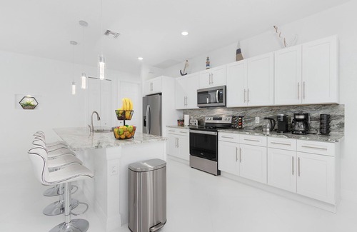 Trafalgar House | Modern 4BD/3BH Waterfront Home with Heated Pool and Golf Access and EV Charger