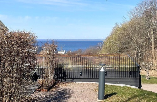 Bastad Apartment | Modern and comfortable vacation apartment with shared outdoor pool, in the summery town of Båstad.