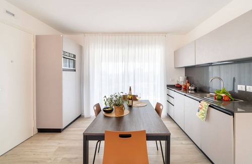 Lignano Sabbiadoro Apartment | Modern apartment with solarium and panoramic lagoon and seaview