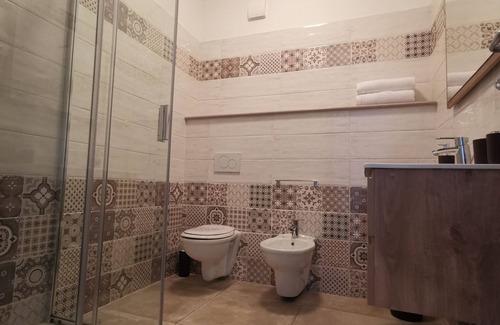 Santa Domenica Apartment | Modern apartment with communal pool surrounded by a beautiful garden