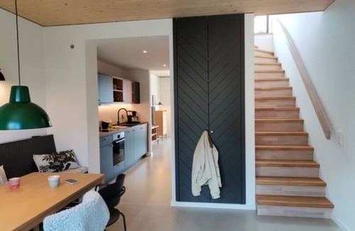 Hohwacht Apartment | Modern duplex apartment with rooftop terrace.