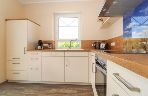 Norden Apartment | Modern first floor apartment with sauna and beach chair in the garden for 4 persons