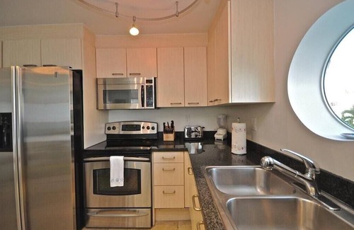 South of Fifth Condo | Modern Luxury Only Steps To The Sand! Huge Patio Deck, Modern Artwork & Extras