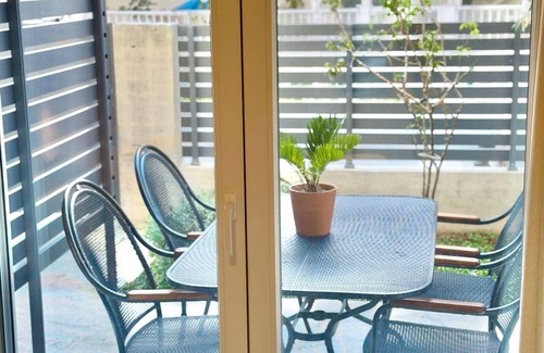 Olymbiaki Akti Apartment | Modern Seaside Home with Private Patio + Parking - Blue Zone Homes
