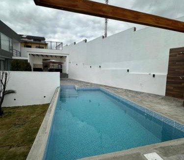 Cuenca Apartment | Modern suite with pool facing the park