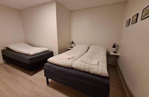 Torshavn Apartment | Modern unit with a king-size bed and a bathtub