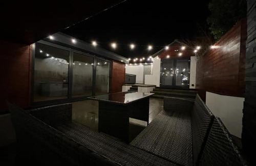 Roughton House | Modern upside down property with hot tub