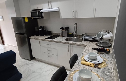 Playa del Carmen Apartment | Modern vacation apartment with gym, jacuzzi, rooftop pool and sauna.