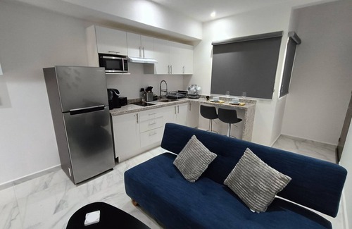 Playa del Carmen Apartment | Modern vacation apartment with gym, jacuzzi, rooftop pool and sauna.