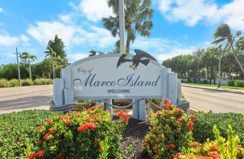 Naples House | Modern waterfront home in Artesia with pool/gym