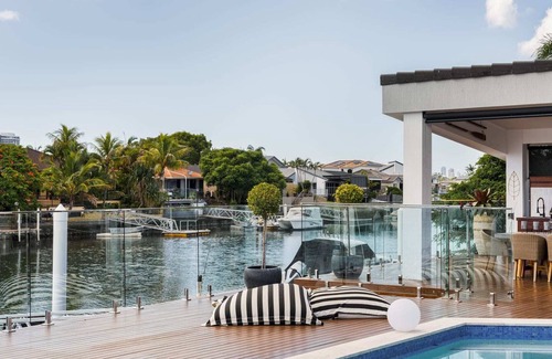 Runaway Bay House | Modern Waterfront Retreat| Private Pool & Dock