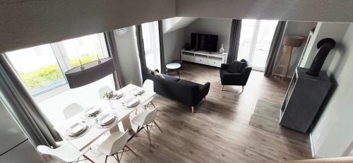 Trossingen Apartment | moderne Neubau-Wohnung mit Kamin und 35qm Dachterrasse