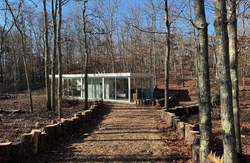 Water Mill House | Modernist Glass House nestled in tall pines and nature offering total privacy