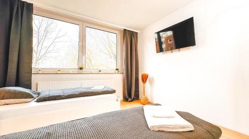 Hustadt Apartment | Monteurwohnung mit Balkon und Wohnzimmer