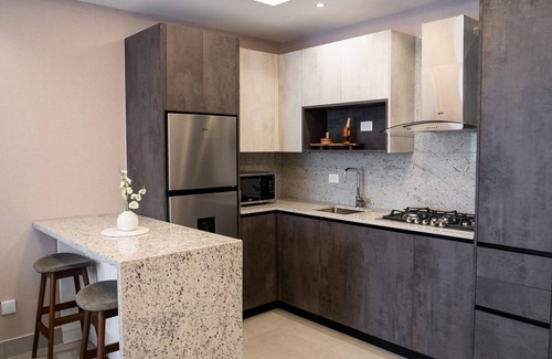 Santiago Province Condo | Monumental Suite: Elegant Modern Apt, Stunning City Views & Rooftop Pool.