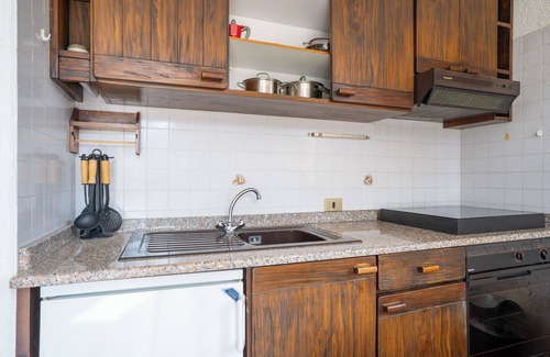 Barzio Apartment | Mountain lodging with fireplace and mountain view