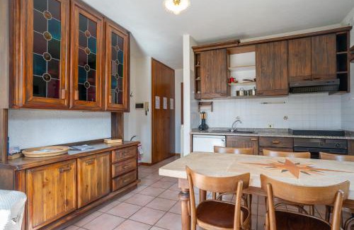 Barzio Apartment | Mountain lodging with fireplace and mountain view