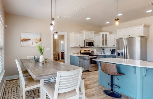 Crestview House | Nautical-themed retreat with a saltwater pool, fire table, full kitchen, and AC