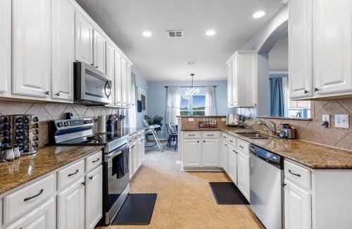 Cibolo House | Nestled in Schertz, Serene Views is your ideal retreat for both short and extended stays. This spacious 5-bedroom, 3.5-bath home features a private heated pool, walking trails, and a game room, offering ultimate relaxation for up to 10 guests.