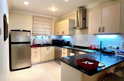 Callendar Condo | Nestled on the prestigious Barbados Golf Course, this charming two-bedroom called “Island Time”