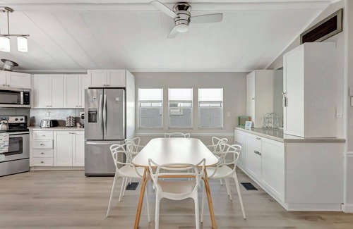 Hutchinson Island South Cottage | Nettles Island Waterfront with Dock & steps from Beach-plus Golf Cart Credit