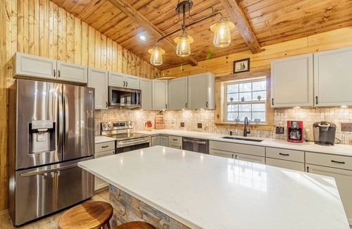 West Union Cabin | New 3 Bedroom Log Cabin nestled in the woods with one acre fishing lake .
