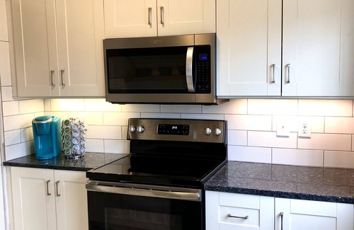 Dubuque House | NEW Central Air! Cute, family home, large fenced backyard and patio area!