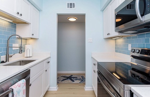 Caine Woods Condo | NEW LISTING as of 5/30/24 with pool + tennis courts too!nSpacious and ALL new!