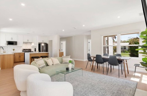 The Plaza House | *New* modern pool home + 5 mi to beach + sleeps 14