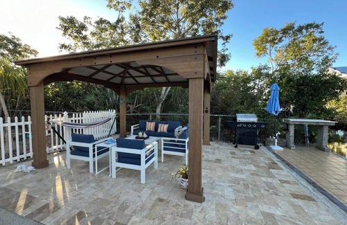 Port Pine Heights House | NEWLY RENOVATED 3/2 WITH POOL AND CANAL ACCESS!