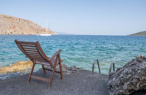 Galaxidi Villa | Nisaia is a villa with a small garden with barbeque next to the sea.