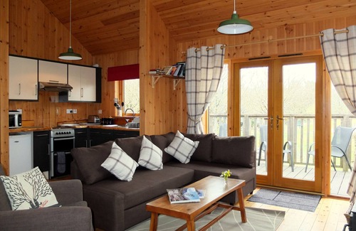 Taynuilt Cabin | OAK is a charming, well equipped log cabin with hot tub and wood burning stove