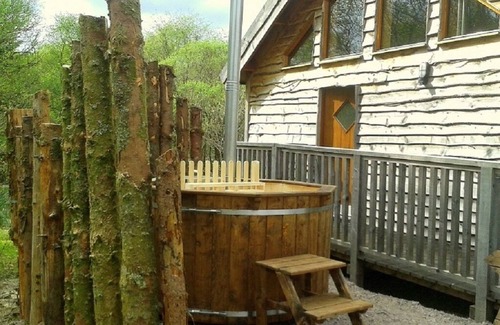 Taynuilt Cabin | OAK is a charming, well equipped log cabin with hot tub and wood burning stove