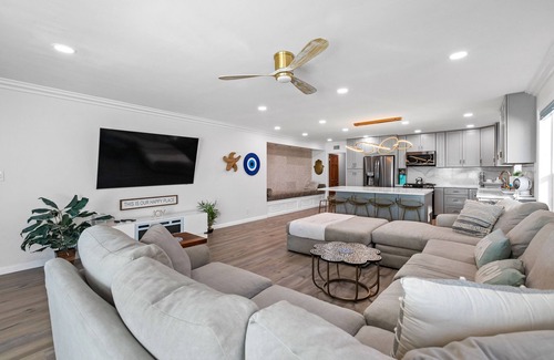 Alamitos Beach House | Oceanfront retreat with rooftop deck, modern interior, marble finishes, & W/D