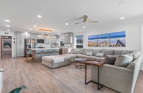 Alamitos Beach House | Oceanfront retreat with rooftop deck, modern interior, marble finishes, & W/D