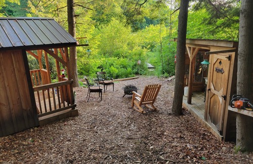Rome Cabin | Off Grid Cabin nestled in the woods next to a stream at the base of Tug Hill
