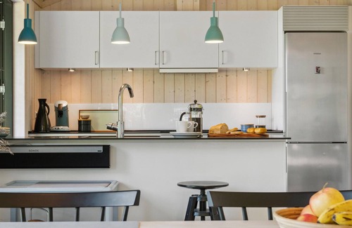 Holbaek House | On the shore of Lammefjord, this grand and modern vacation home welcomes you.