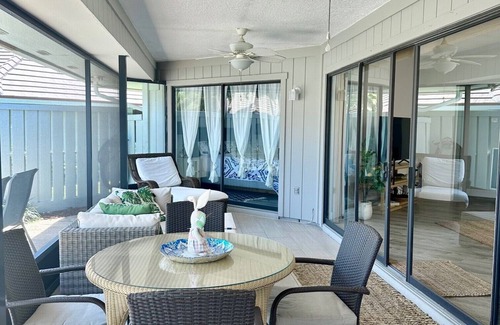 Jupiter Bay Condo | One level villa. Clubhouse, pool, tennis. Barbeque on patio. Two parking spaces.