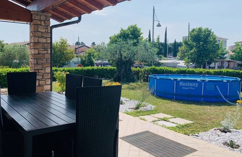Moniga del Garda Ski Chalet | Orange: private house with garden in the centre of Moniga del Garda