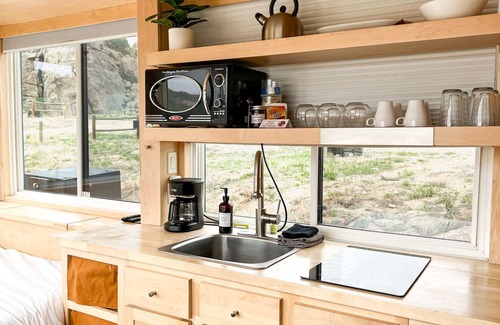 Buena Vista House | Oxford is a one-level 1-2 person Tiny Home with full bathroom, fridge, induction cooktop, microwave, AC/heat, dryer/washer combo, and beautiful mountain views!