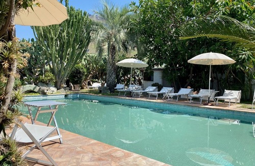 Panza Apartment | "Palm Cottage" with garden, swimming pool and spa hot tub