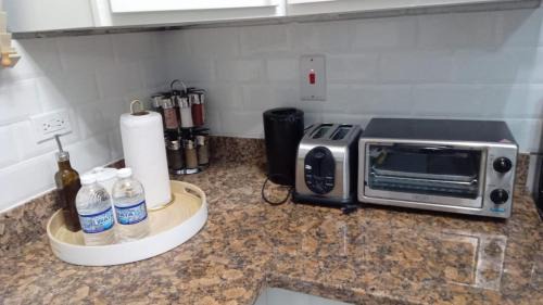 New Kingston Apartment | Paradise Haven at Hamptons - -across from Ac Marriot Hotel