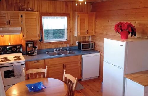 Souris Cottage | Peaceful river view cottage close to world class sandy beaches