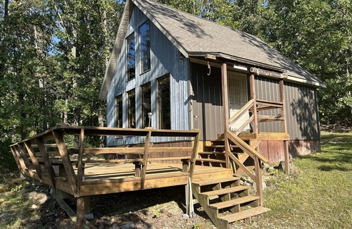 Elk Creek Cabin | Peaceful secluded cabin nestled on 40 wooded acres overlooking 4 acre pond.